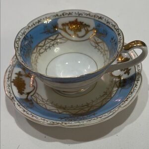 Elegant Blue and Gold Teacup and Saucer Set